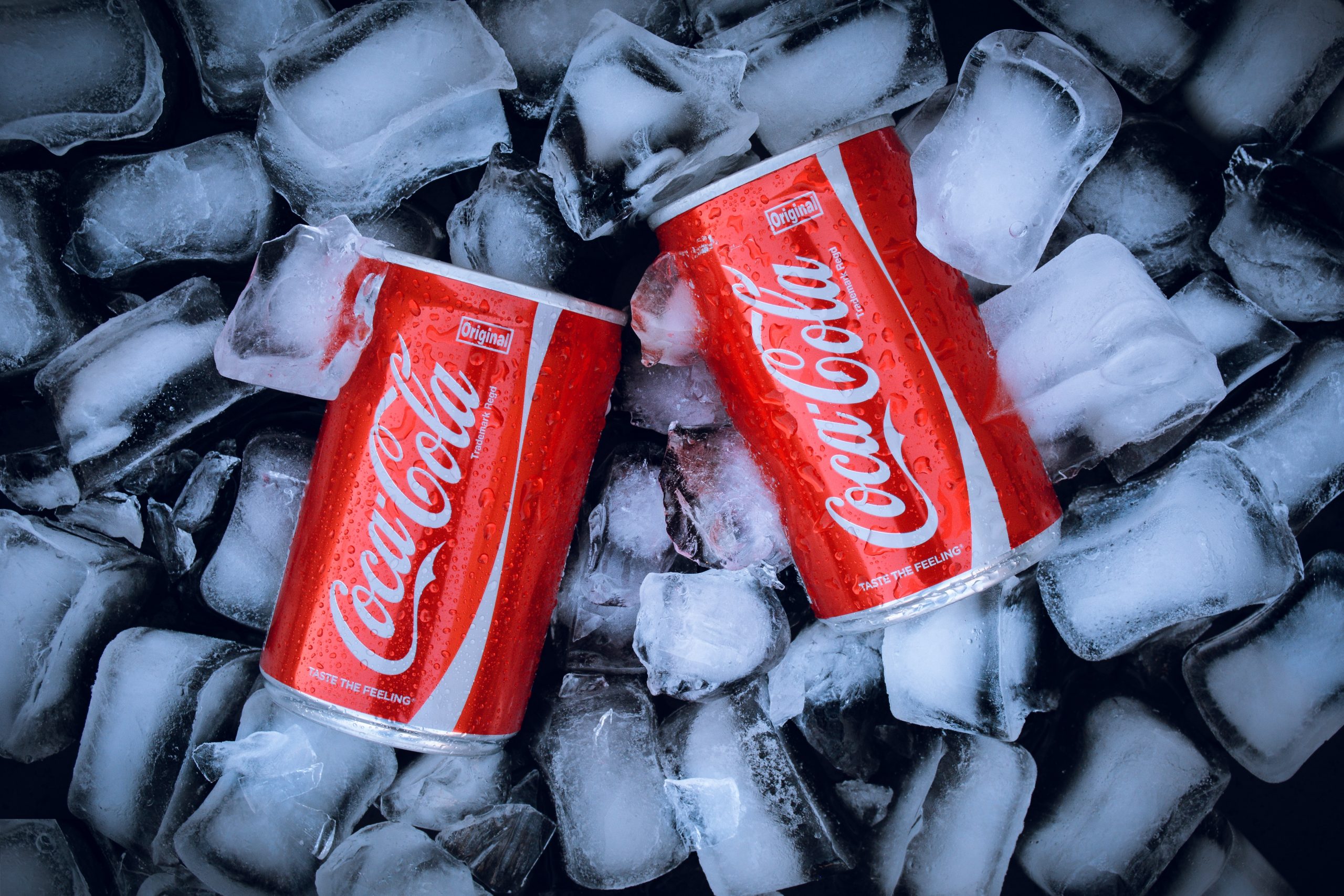 2 cans of coke on ice